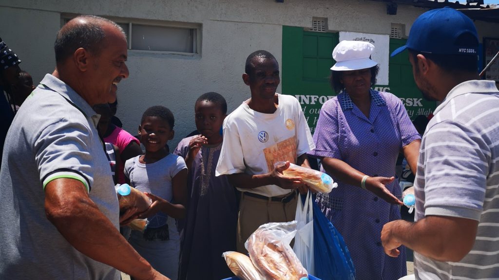 Alex-feeding-bread-distribution-1024x576